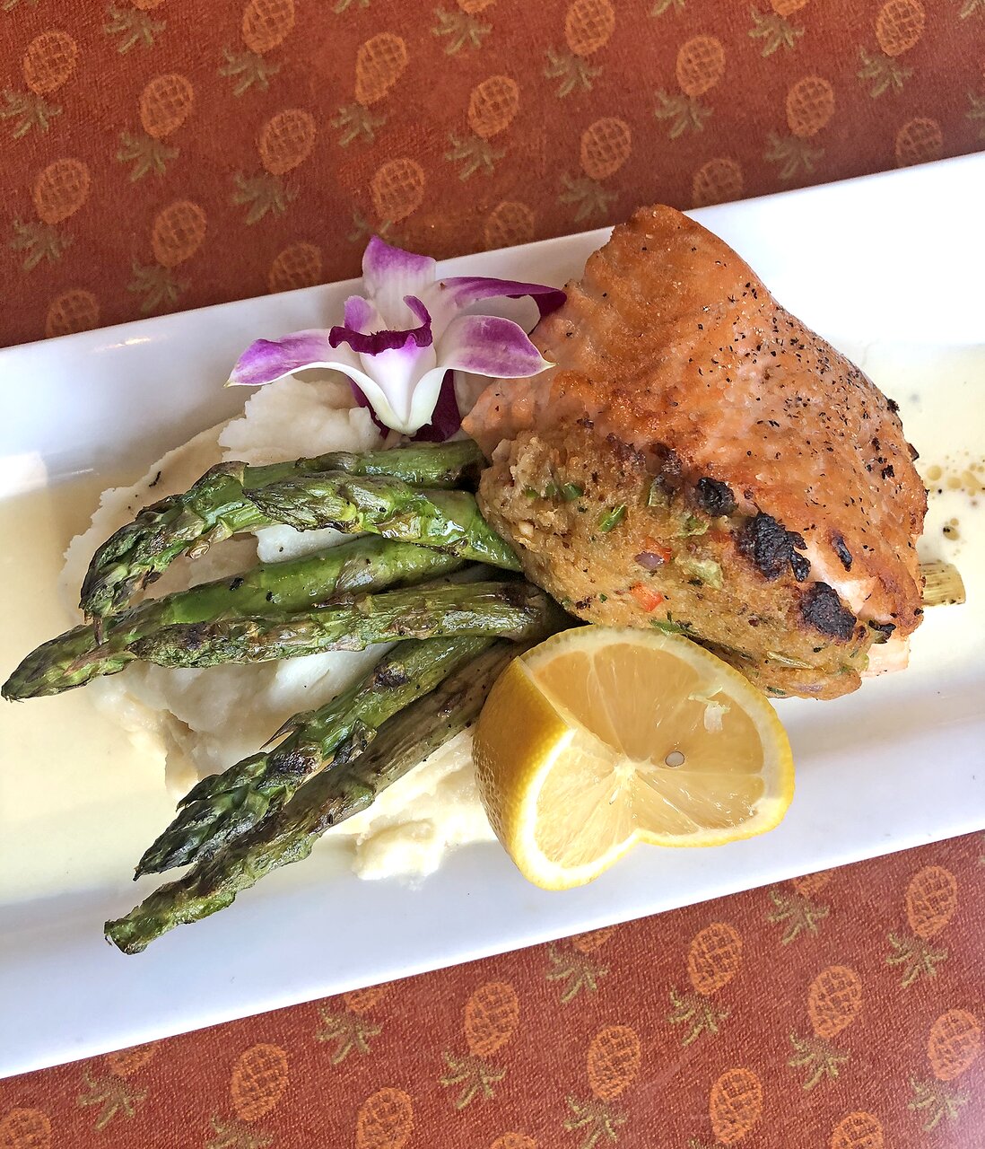 Pisces Rising signature dishes Shrimp & Grits, Crab Stuffed Salmon, Mushroom Ravioli.